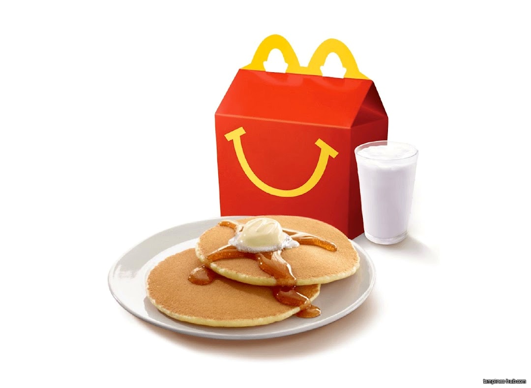 McDonald's Happy Meal with pancakes, syrup, butter, and a drink.