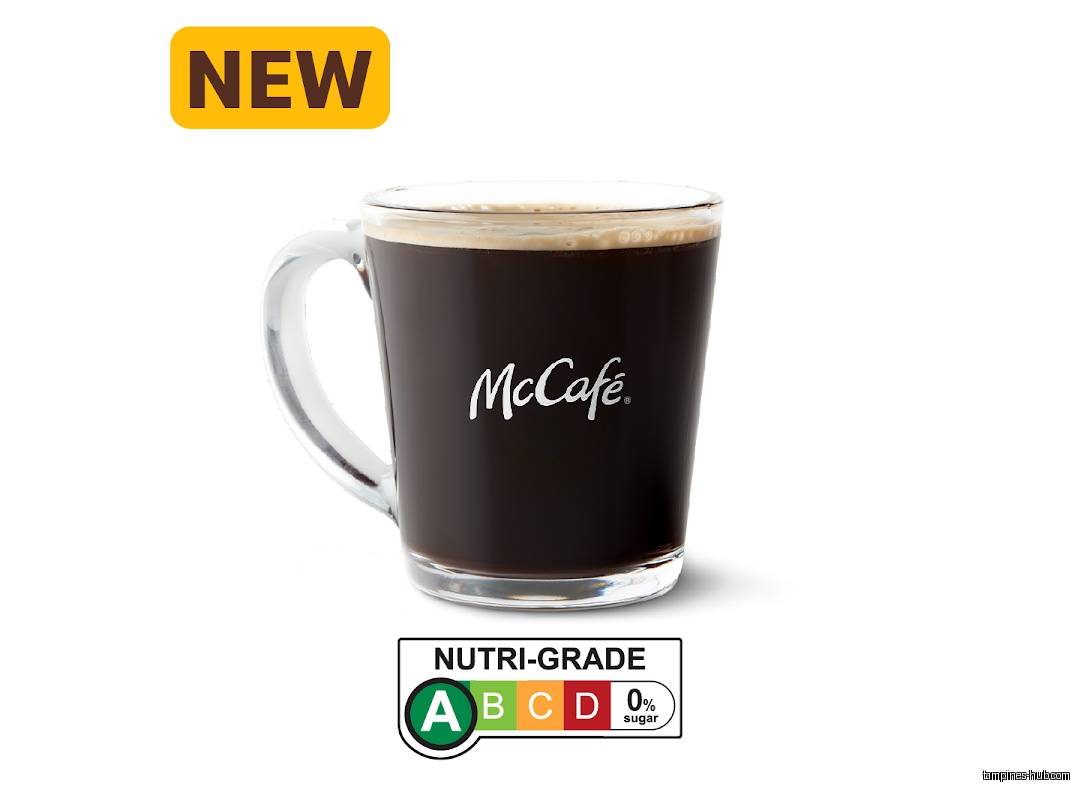 A McCafé black coffee in a glass mug with a nutri-grade label.