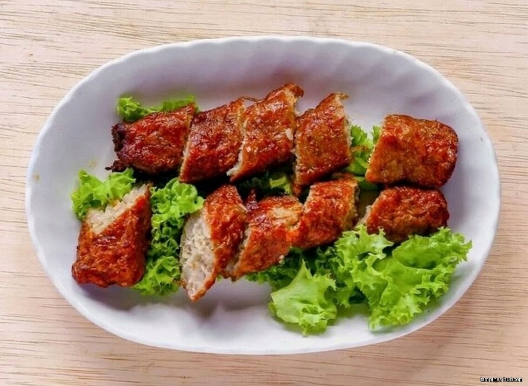 A plate of fried food with lettuce, likely from Ming Fa Fishball.