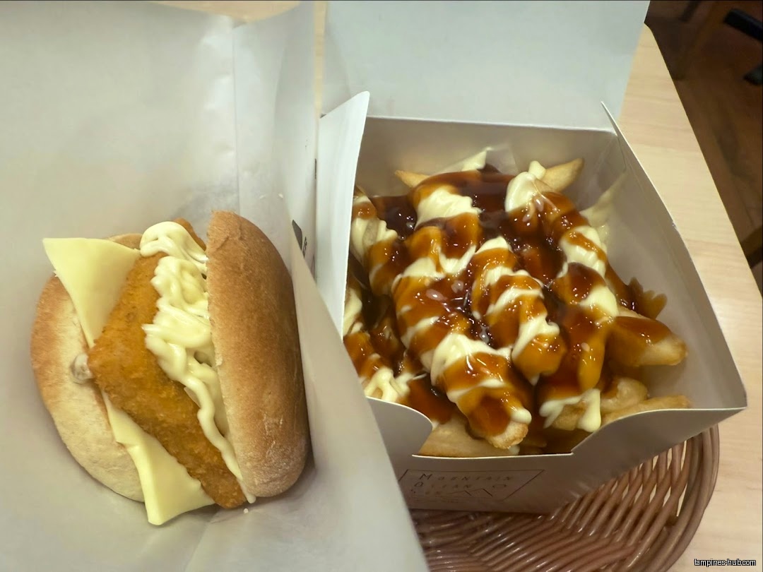 A fish burger and fries with sauce are in their containers.