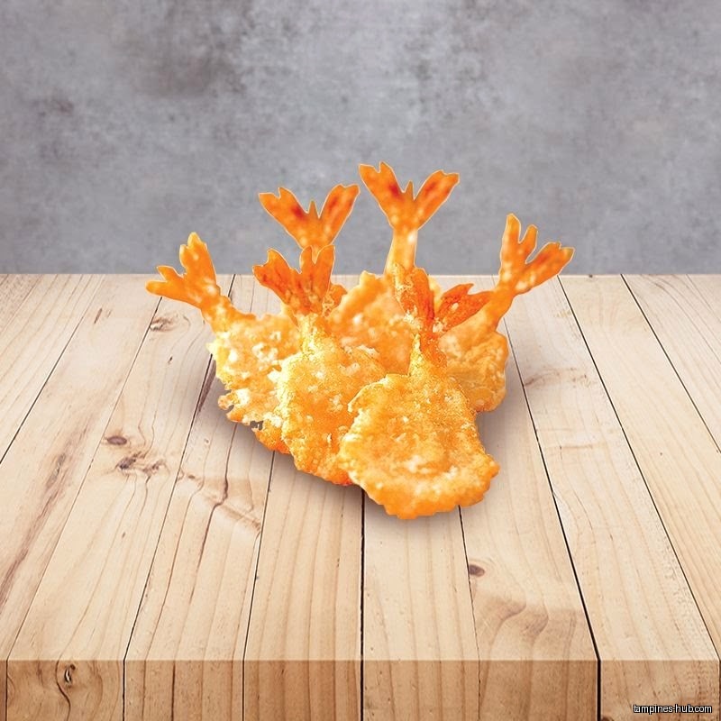 The image shows a stack of fried shrimp on a wooden surface.