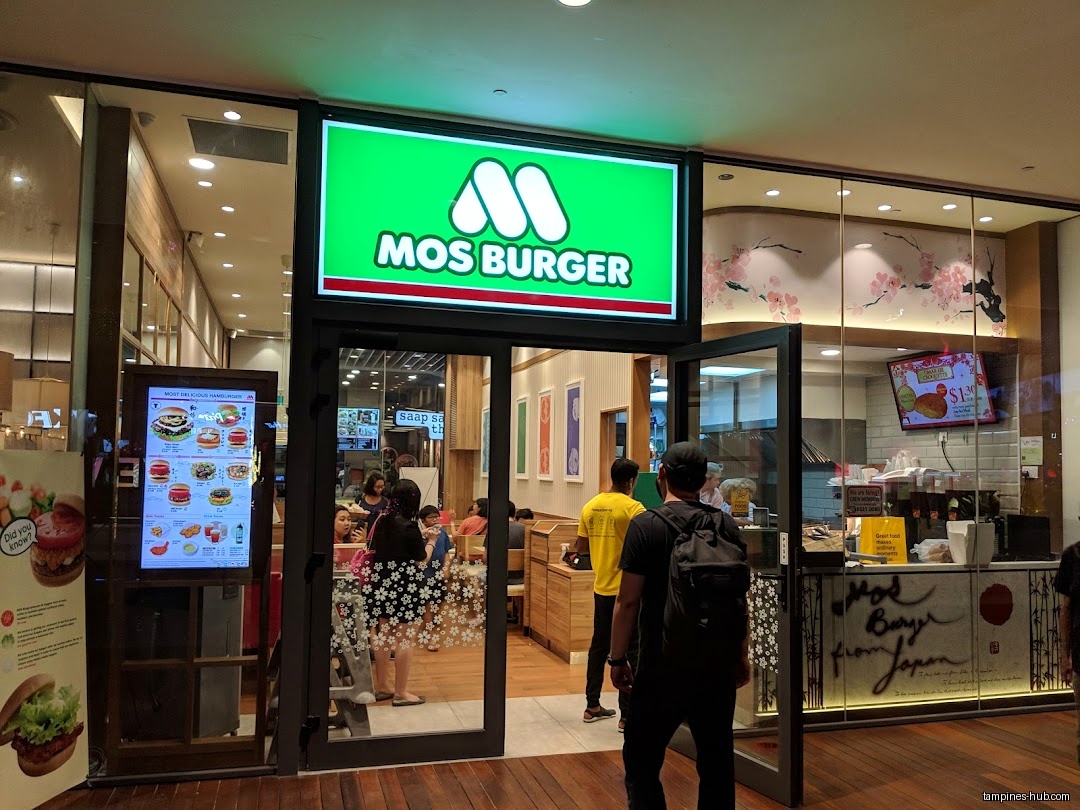 The image shows the entrance and storefront of a MOS Burger restaurant.