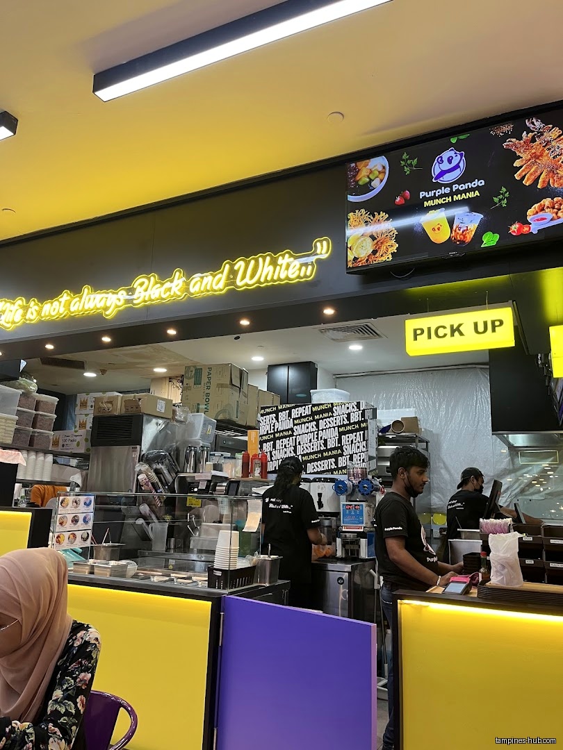 The image shows the interior of Munch Mania by Purple Panda.