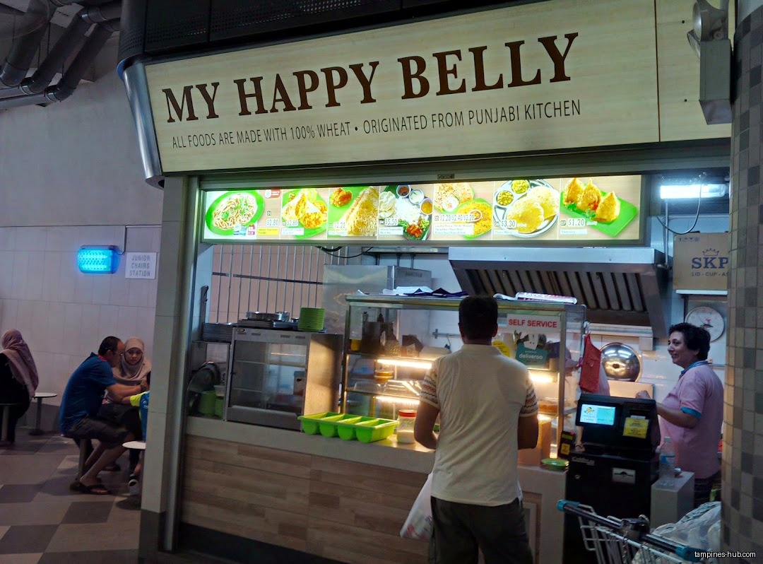 My Happy Belly shop front with menu board and customers.