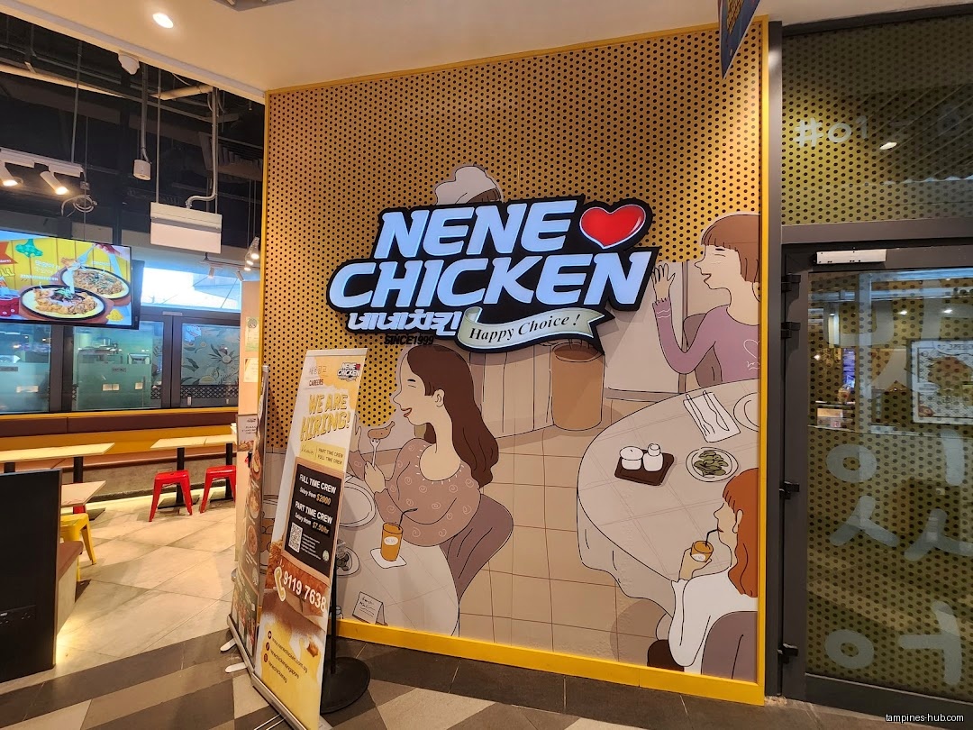 NeNe Chicken shop front with logo and cartoon wall art.