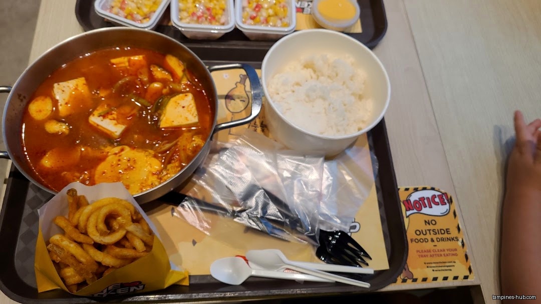 A tray of NeNe Chicken food with soup, rice, and curly fries.