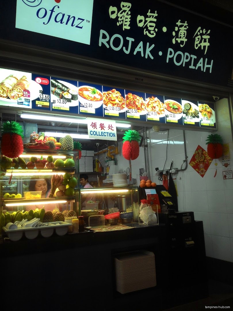 Ofanz Rojak • Popiah shop front with menu and food display.
