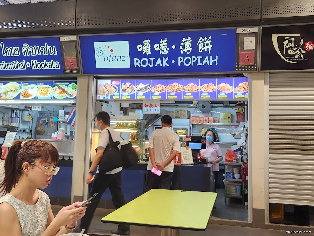 Ofanz Rojak • Popiah shop front with menu and staff visible.