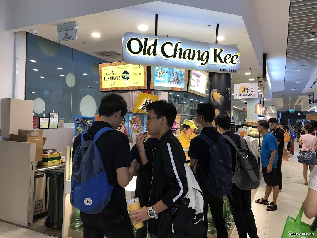 People queue at Old Chang Kee Coffee House in a mall.