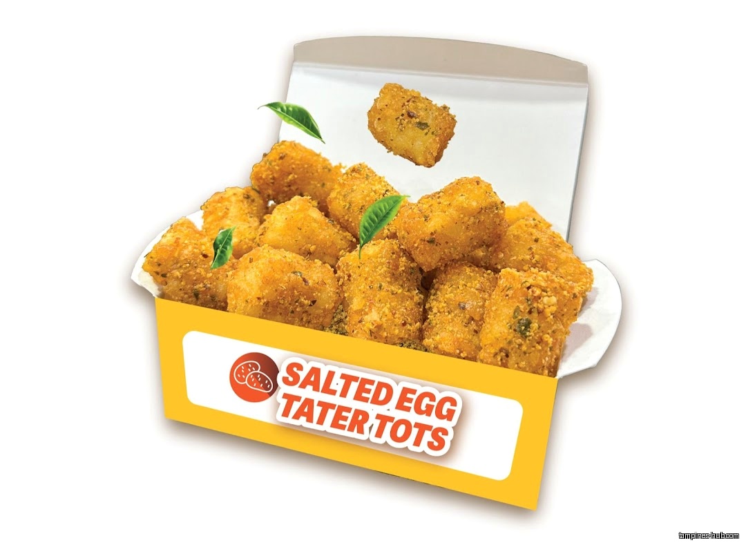 A box of Old Chang Kee Salted Egg Tater Tots with green leaves.