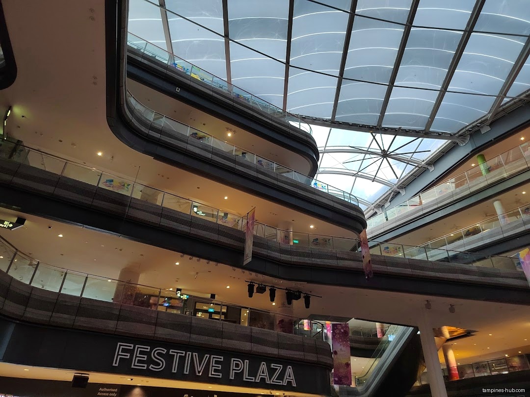 Interior view of Festive Plaza with multiple levels and a glass roof.