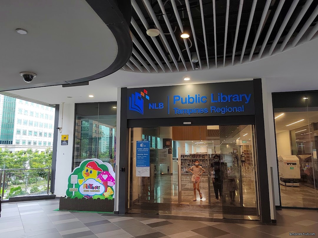 Exterior view of NLB Public Library Tampines Regional entrance with signage.