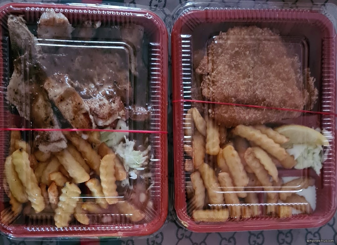 Two takeaway containers with western food: steak/fish, fries, and salad.