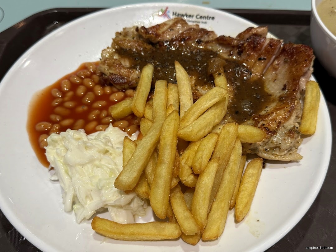 A plate of western food with chicken, fries, beans, and coleslaw.
