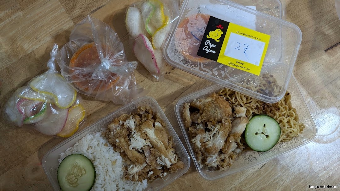 The image shows several takeaway containers of food from Papa Ayam.
