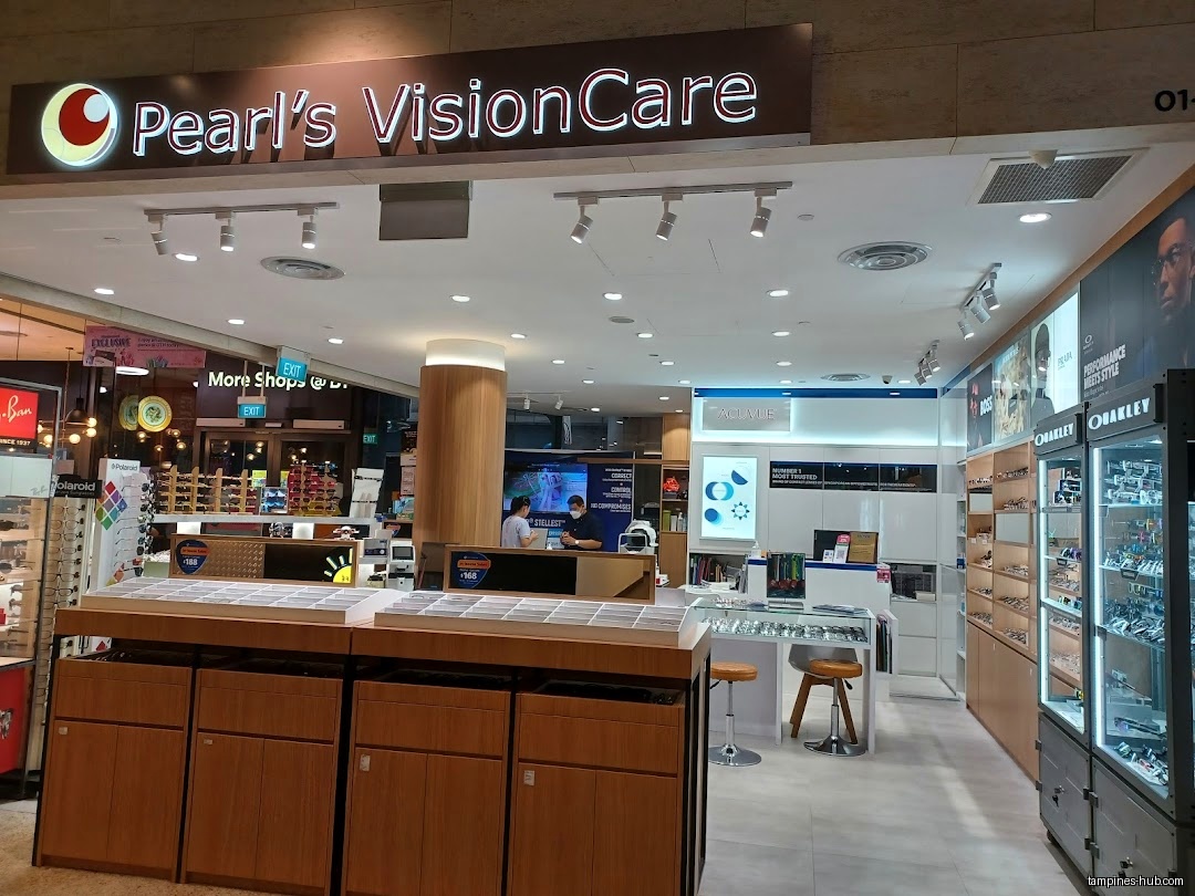 Pearl's VisionCare shop front with displays of eyewear and customers inside.