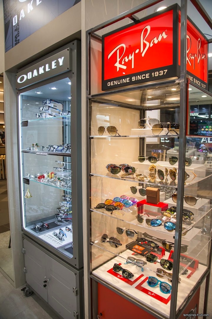 Display cases showcase Oakley and Ray-Ban sunglasses and eyewear inside Pearl's Visioncare.