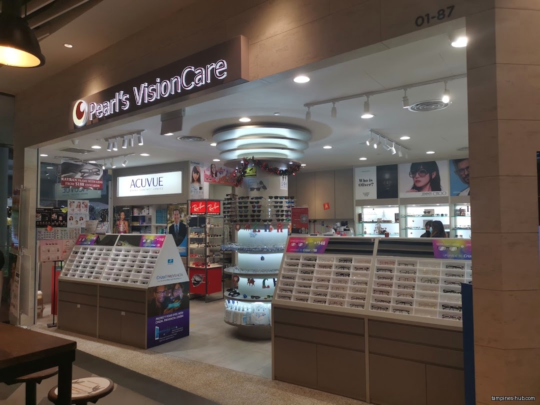 Pearl's VisionCare shop front with displays of eyeglasses and contact lenses.