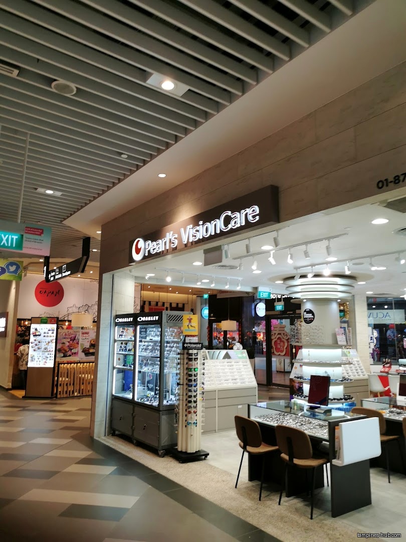 The shop front of Pearl's Visioncare with eyewear displays and seating.