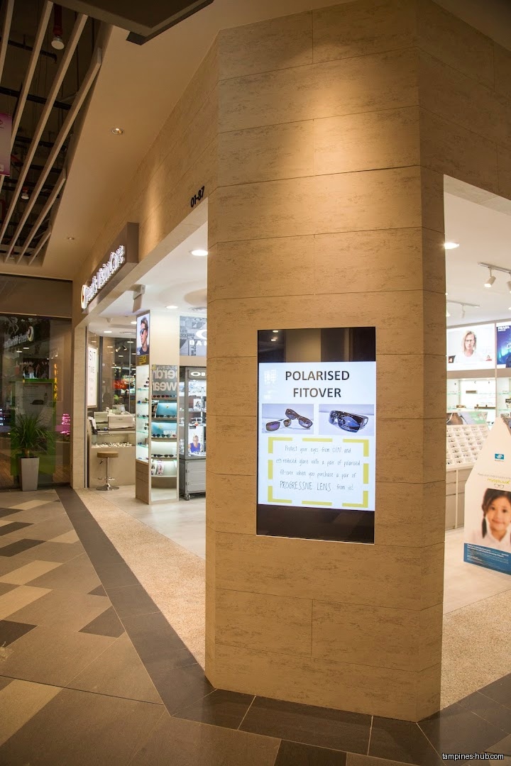 Pearl's Visioncare shop front with a digital display showing sunglasses.