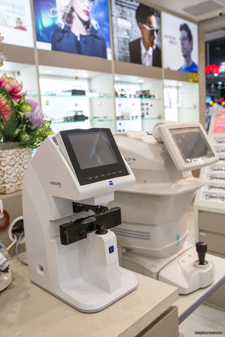 The image shows eye exam equipment inside Pearl's Visioncare shop.