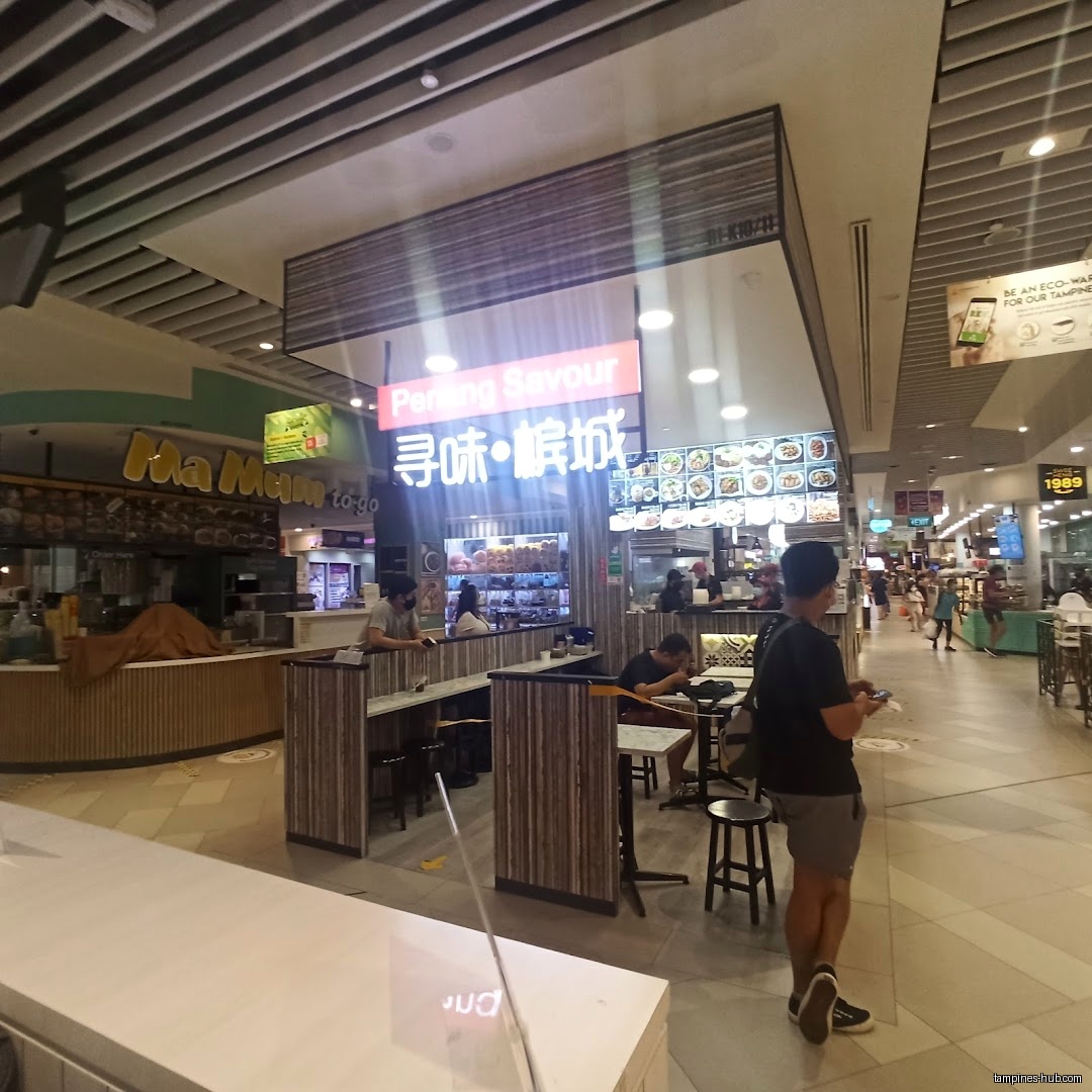 Interior view of Penang Food Cuisine PTE LTD with customers and menu board.