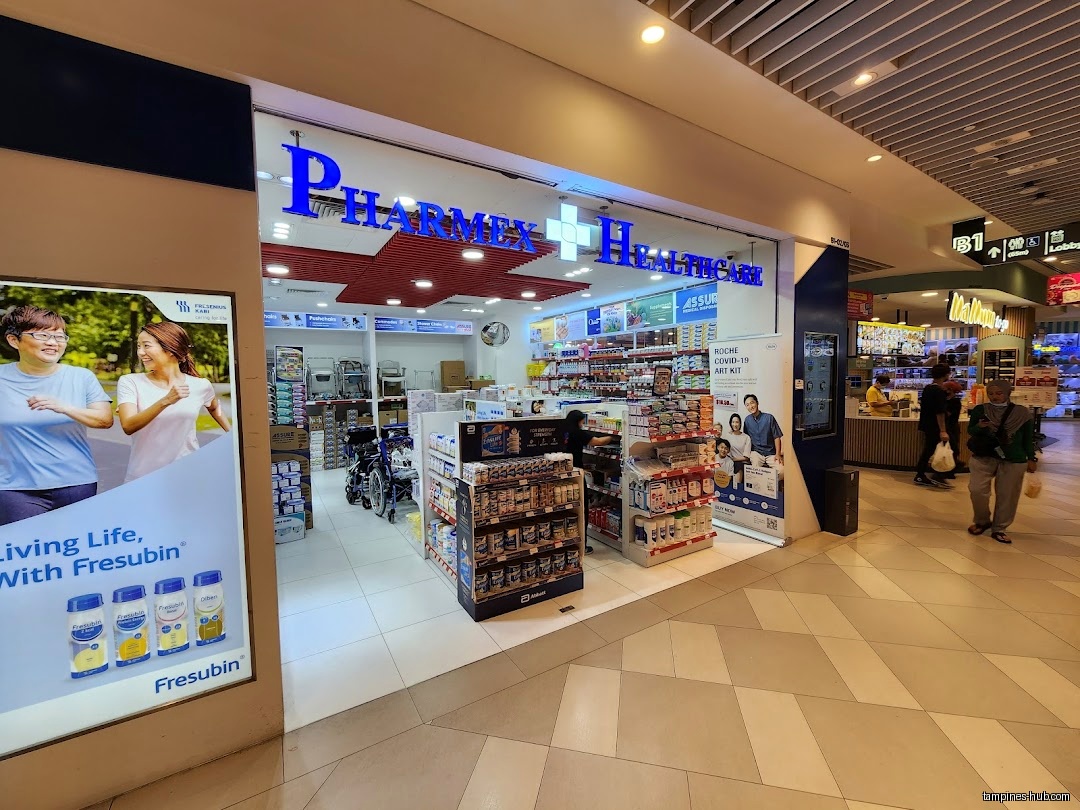 Pharmex Healthcare shop front in a mall with product displays visible.