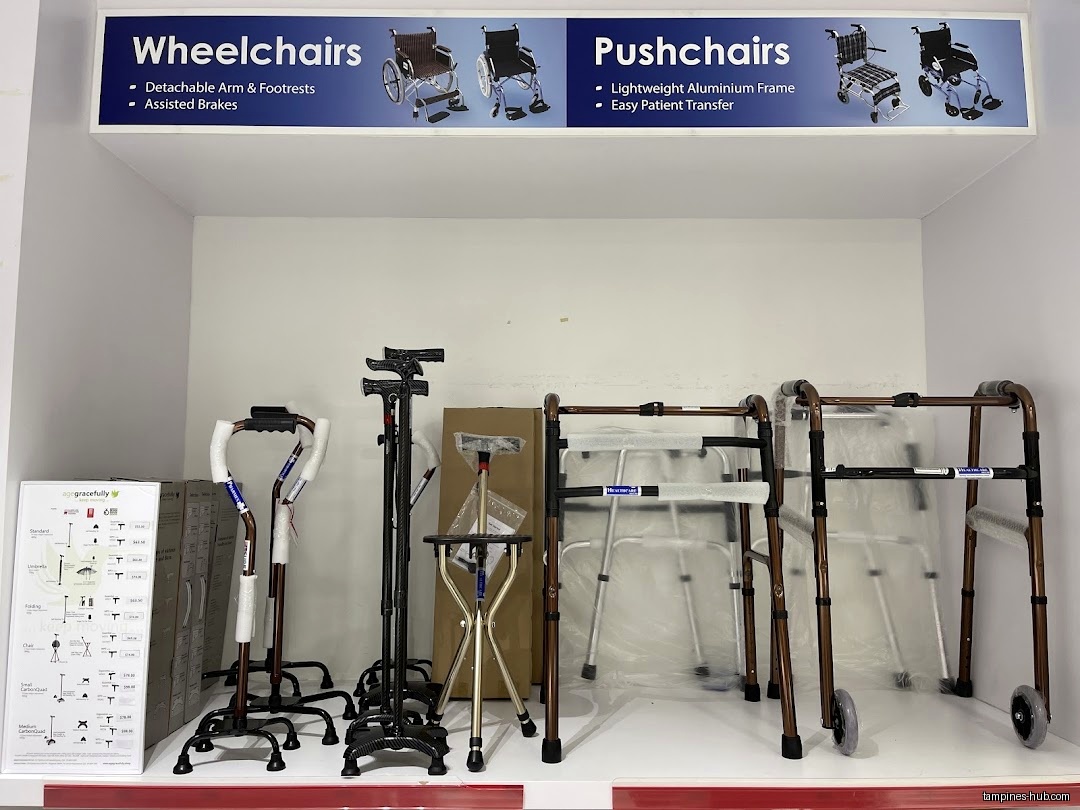 The image shows a display of wheelchairs, pushchairs, walkers, and canes.