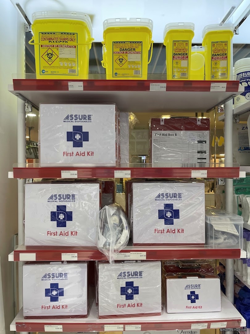 Shelves display first aid kits and sharps disposal containers in a store.