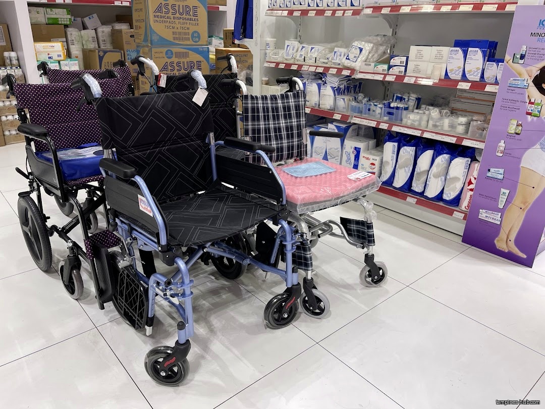 The image shows wheelchairs and medical supplies on shelves inside Pharmex Healthcare.
