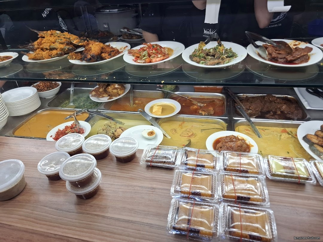 The image shows a food display case with various dishes and containers.