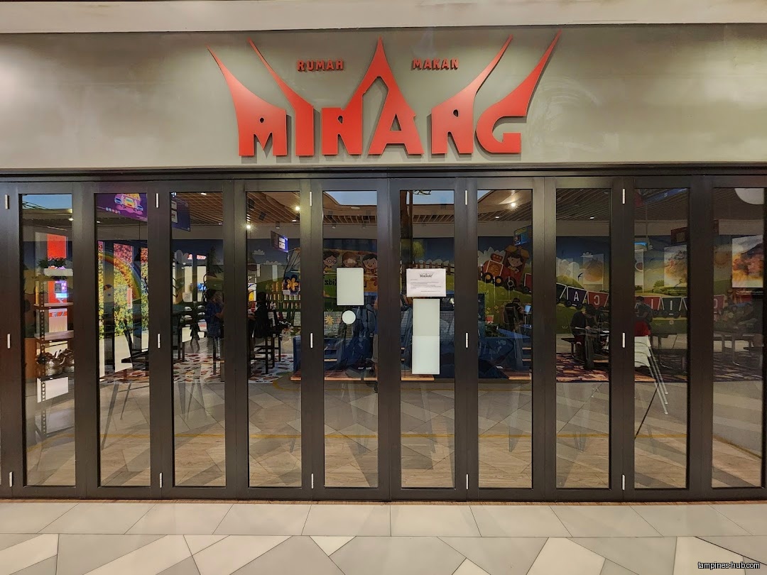 The shop front of Rumah Makan Minang with folding glass doors.
