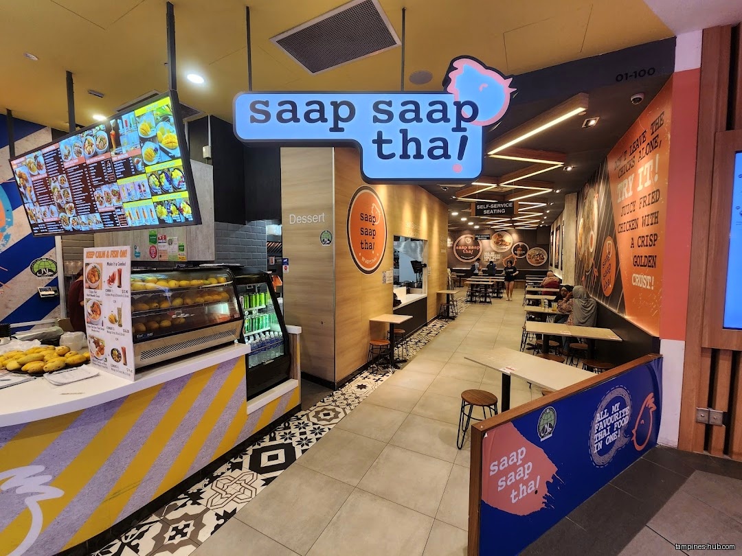 Interior view of Saap Saap Thai restaurant with menu board and seating.