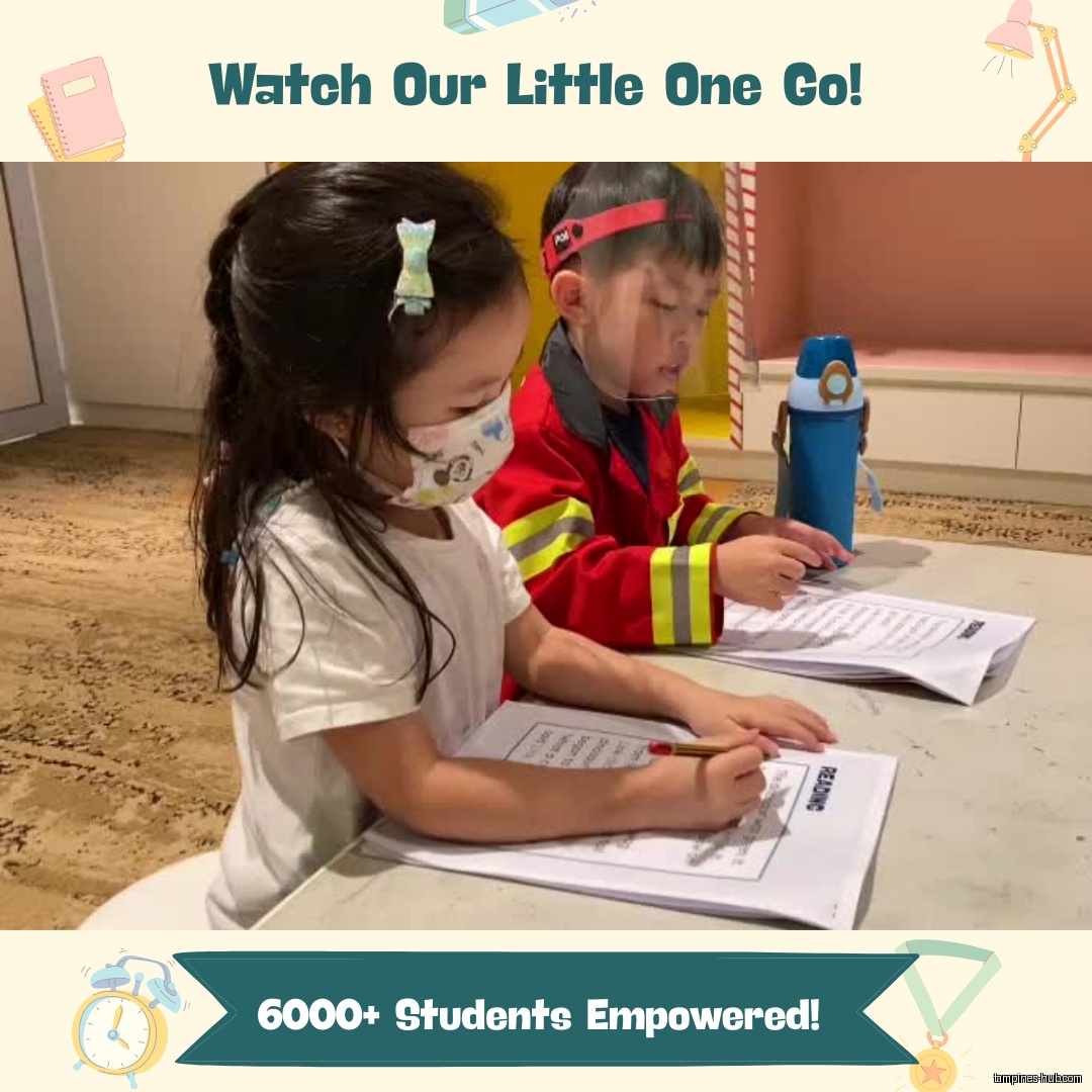 Two children are sitting at a table doing a reading worksheet.
