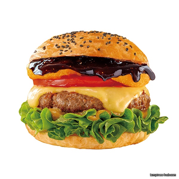 A burger with lettuce, cheese, tomato, and a dark sauce on top.