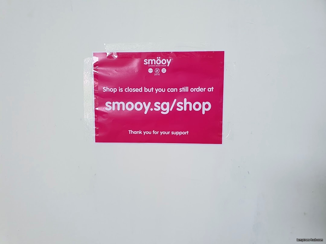 A sign on a wall indicates the Smöoy shop is closed.