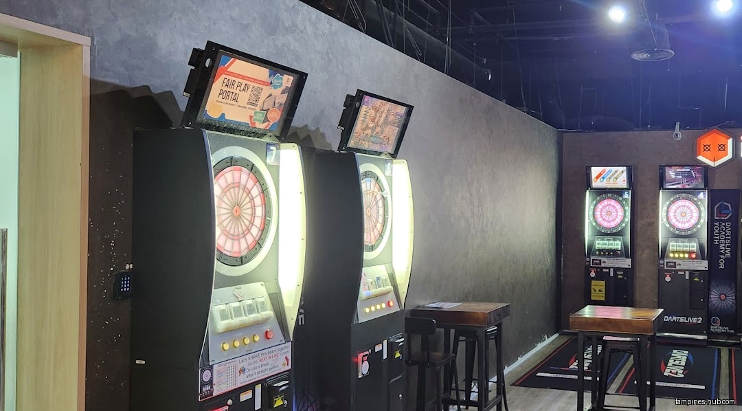 The image shows a row of electronic dartboards inside Sonic Bowl.