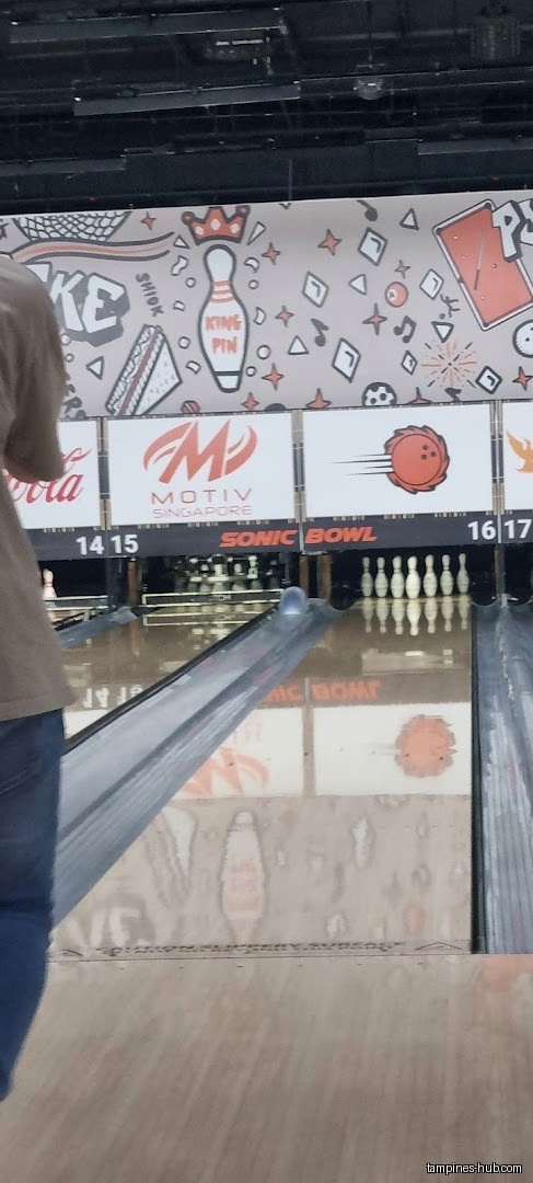 Bowling lanes at Sonic Bowl with pins and lane dividers visible.