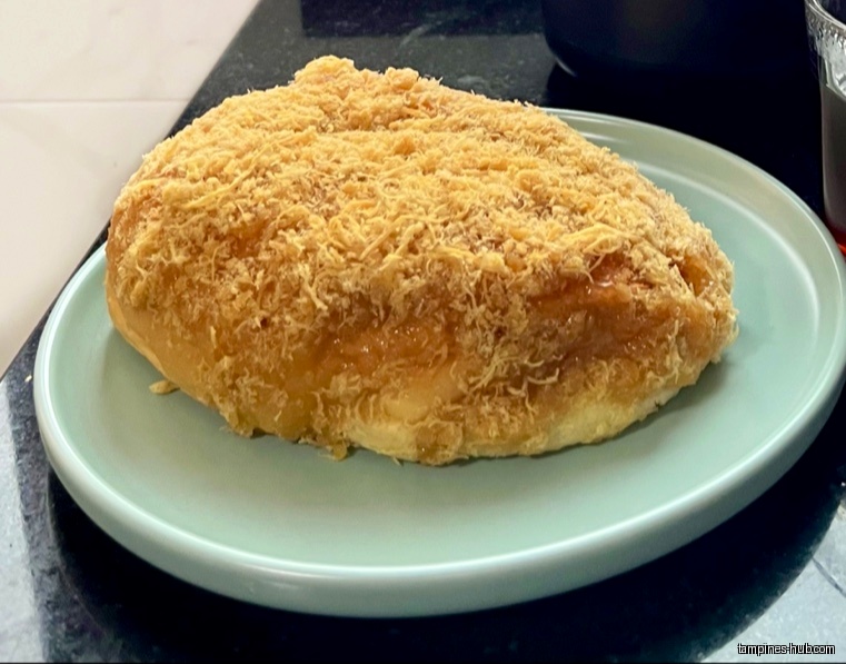A pork floss bun from Swee Heng 1989 Classic on a plate.