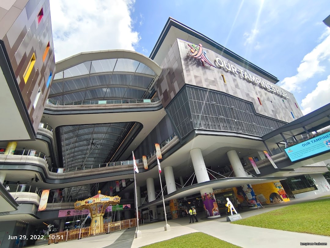 Exterior view of Our Tampines Hub, a multi-story complex with shops.