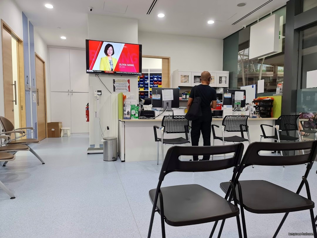 The image shows the interior of Tampines Family Medicine Clinic waiting area.