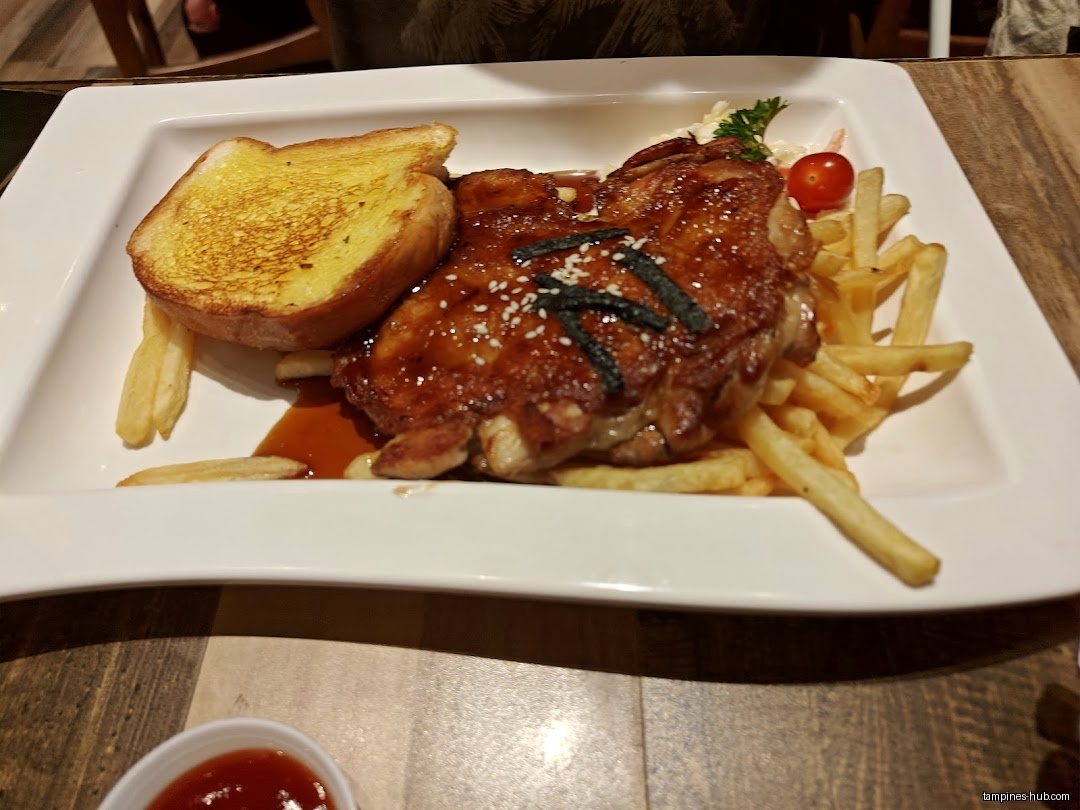 A plate of chicken, toast, and fries is shown.