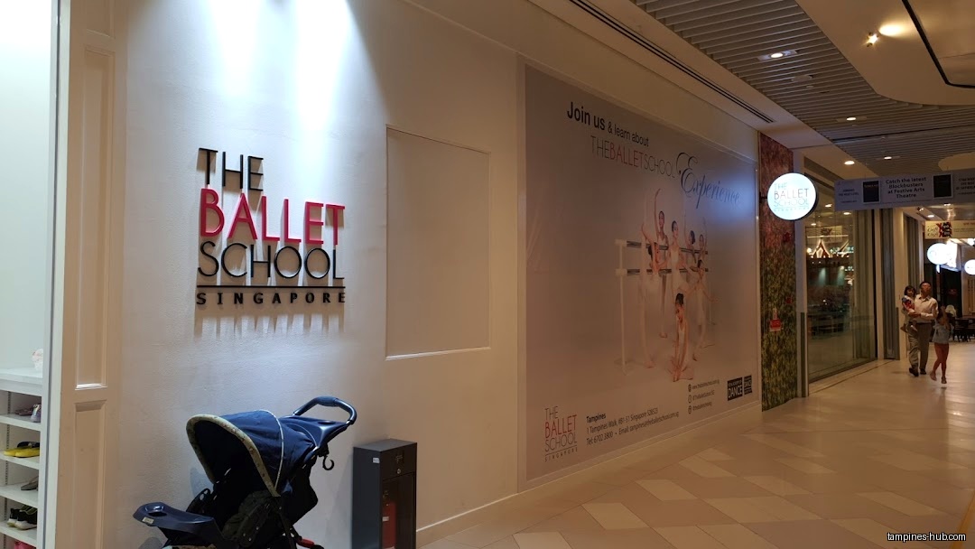The Ballet School Singapore entrance with logo and promotional poster.