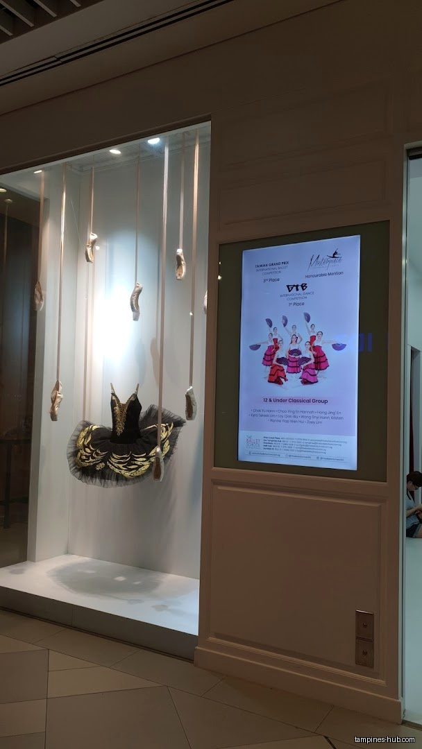 The Ballet School Singapore shop front with tutu and pointe shoes display.