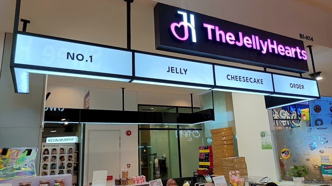 TheJellyHearts shop front with signs for jelly, cheesecake, and orders.