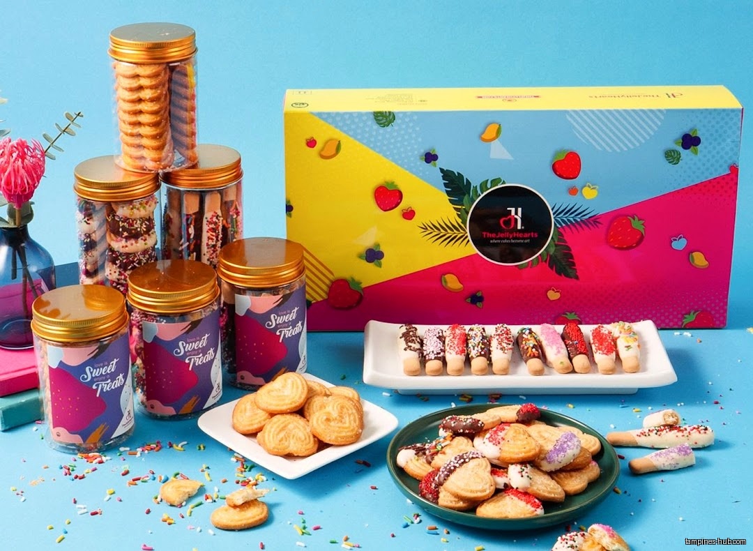 TheJellyHearts displays cookies, biscuits, and a gift box on a blue background.