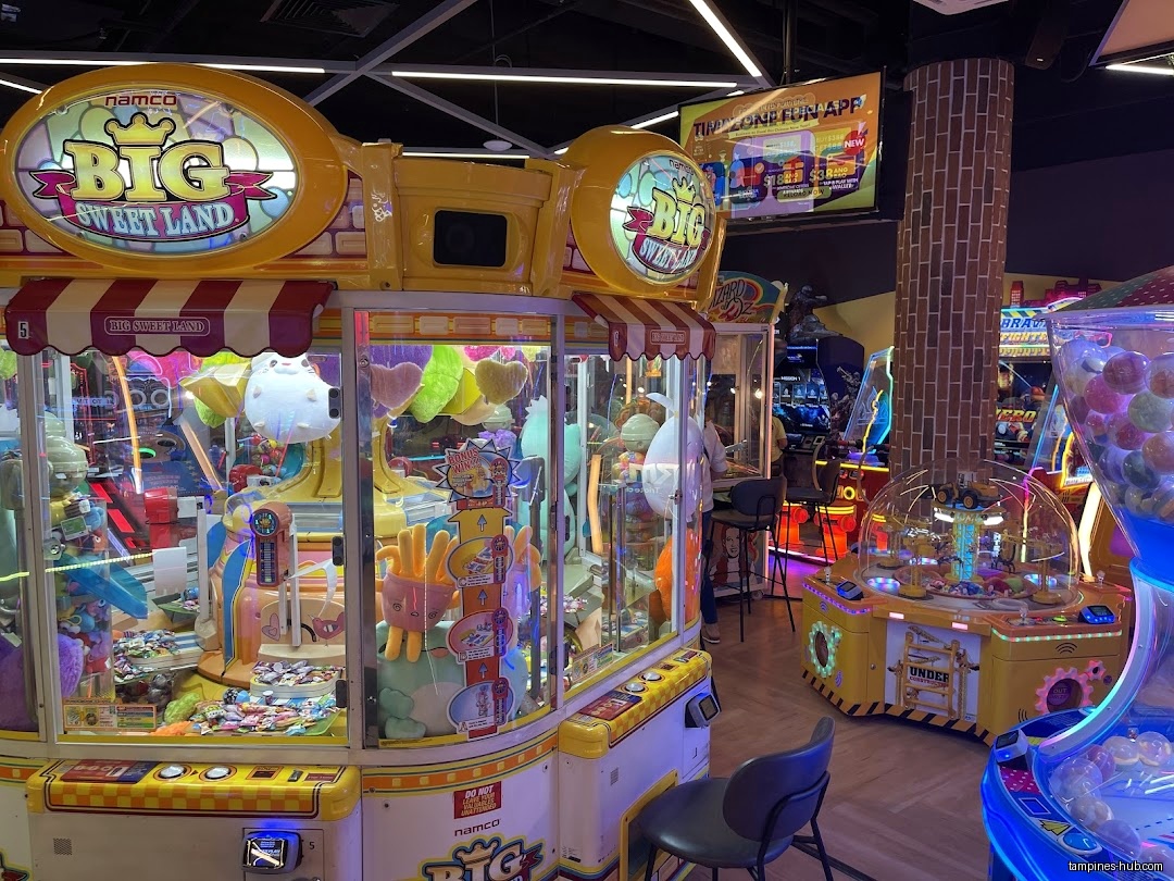 The image shows the interior of Timezone with claw machines and arcade games.
