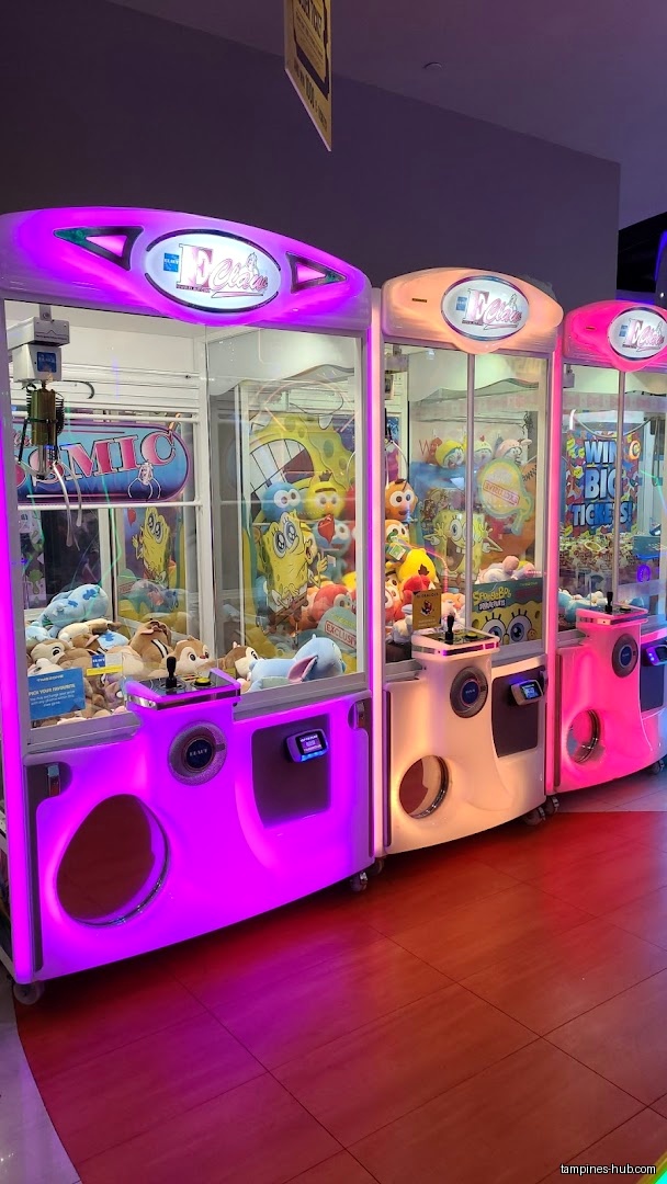 Three claw machines filled with plush toys are lined up in a row.
