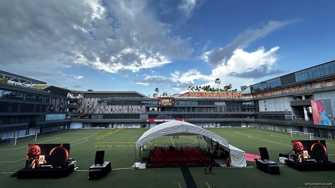 Town Square, Our Tampines Hub, shows a stage set up on a field.