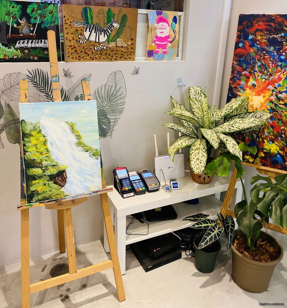 Interior shot of art shop with paintings, plants, and payment terminals.